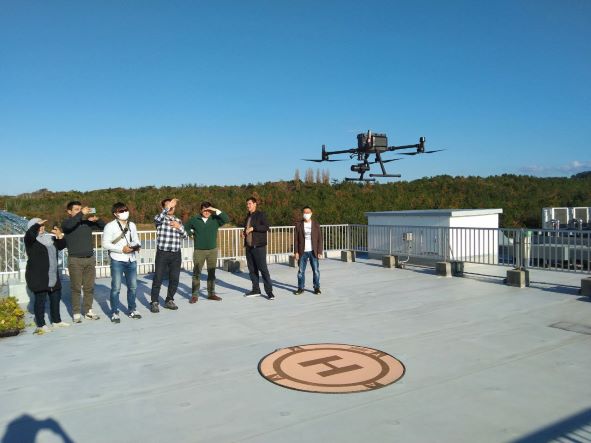 Trainees learning how to fly a drone